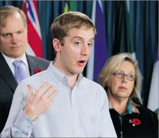  ?? Adrian Wyld/canadian Press ?? Green party leader Elizabeth May, right, and NDP critic Peter Julian, left, listen to Matthew Carroll, of Leadnow.ca, protesting The Foreign Investment Protection and Promotion Agreement (FIPA) with China.