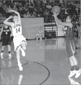  ?? MARK HUMPHREY ENTERPRISE-LEADER ?? Elkins junior Allison Coleman is too late to prevent Prairie Grove’s Larisha Crawford from shooting a 3-pointer. Crawford hit a pair of 3-pointers in the Lady Tigers’ 49-40 loss to the Lady Elks Friday.