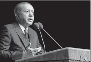  ?? AP ?? Turkish President Recep Tayyip Erdogan, shown speaking Wednesday at a symposium in Ankara, Turkey, said no one connected with the death of Saudi journalist Jamal Khashoggi will “avoid justice.”