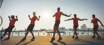  ??  ?? Above &amp; left: People join the ‘Unlimited moves by Fitness First’ programme on the main stage at Dubai Festival City yesterday.