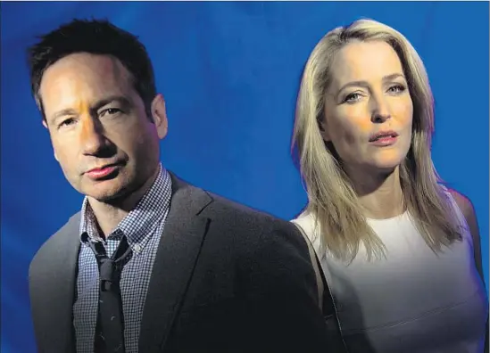  ?? Kirk McKoy Los Angeles Times ?? FOX MULDER and Dana Scully, a. k. a. David Duchovny and Gillian Anderson in real life, are back for six all- new episodes of the paranormal “X- Files” TV series.