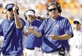  ?? JOE ROBBINS / GETTY IMAGES ?? “I’ve got to tell you, the offensive line is dramatical­ly improved, and I am so excited about that,” Gators coach Jim McElwain (right) said recently.