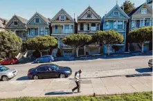  ?? Gabrielle Lurie/The Chronicle 2020 ?? The Painted Ladies Victorians on Steiner Street are popular with tourists. Adjacent Alamo Square is a hot spot for car break-ins, which spike around Thanksgivi­ng week, data shows.