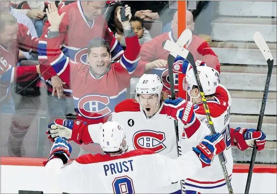  ?? — THE CANADIAN PRESS FILES ?? Montreal Canadiens forward Dale Weise celebrates his goal against the Ottawa Senators with teammates Brandon Prust and Alexei Emelin during the third period of Game 3 in Ottawa on Sunday. Weise later scored the overtime winner.