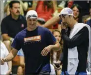  ?? NELL REDMOND — THE ASSOCIATED PRESS FILE ?? A May 15, 2015, file photo, Ryan Lochte, left, and Michael Phelps talk before the start of the 100-meter butterfly final at the Arena Pro Swim Series meet in Charlotte, N.C. Add Phelps’ name to the list of Americans who were less than amused by...
