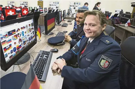  ?? — AP ?? Tight security: Police superinten­dent Heike Schultz (foreground) of the German police speaks to the media at the Internatio­nal Police Cooperatio­n Centre in Moscow yesterday. Russian police will operate a centre for internatio­nal liaison between police...