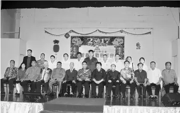  ??  ?? Nanta (seated, centre) with members of the pre-Chinese New Year dinner organising committee in a group photo.