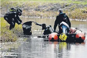  ??  ?? Police remove an object from the canal in the search for the remains of Moira, right.