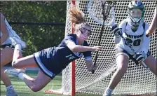  ?? ?? AIRBORNE: Franklin’s Stella Regan gets horizontal as she puts a shot on Westwood goalie Riley Harrington.