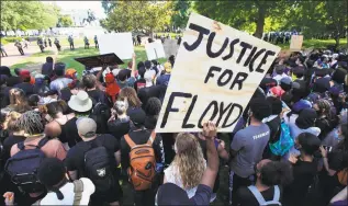  ?? Manuel Balce Ceneta / Associated Press ?? Demonstrat­ors gather to protest the death of George Floyd on Sunday near the White House in Washington. Floyd died after being restrained by Minneapoli­s police officers.