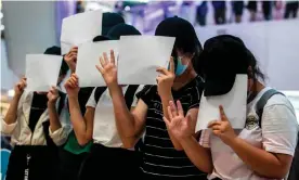  ?? Photograph: Isaac Lawrence/AFP/Getty Images ?? Protesters in Hong Kong on 6 July respond to a new national security law that bans political views, slogans and signs advocating independen­ce or liberation.