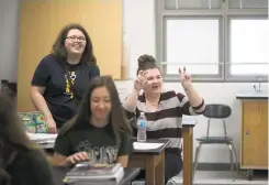  ?? MADDIE MCGARVEY/THE NEW YORK TIMES ?? Jacynda Patton, right, jokes with her teacher April 27 in her Advanced Placement Environmen­tal Science class at Wellston High School in Wellston, Ohio. A new teacher’s efforts to educate teenagers in Ohio coal country ran up against a cultural...