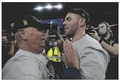  ?? DAVID J. PHILLIP/AP ?? ATLANTA BRAVES MANAGER BRIAN SNITKER and first baseman Freddie Freeman celebrate after winning the World Series in Game 6 against the Houston Astros Tuesday in Houston. The Braves won 7-0.