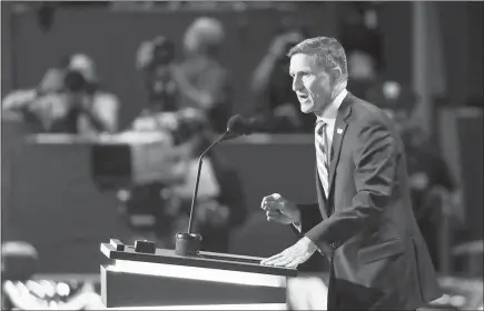  ?? PAUL SANCYA / AP FILE (2016) ?? Lt. Gen. Michael Flynn speaks July 18, 2016, during the opening day of the Republican National Convention in Cleveland. Flynn’s public profile was rising in 2016 before the convention. He had signed a book deal and began hitting the public speaking circuit. The rise of the Islamic State in Iraq and Syria seemed to validate his criticism of Obama administra­tion policy, and Flynn soon become a regular adviser to Donald Trump’s insurgent presidenti­al campaign.