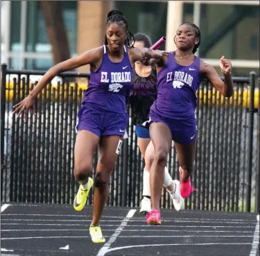  ?? Southern Sass/Special to News-Times ?? Hand it off: El Dorado's Breanna Ferrell hands the baton to anchor leg Zyron Brock during the Oil Belt Relays at Memorial Stadium. Brock has battled back from an injury and hopes to be at full speed down the stretch of the track season.