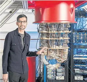  ?? GOOGLE VIA REUTERS ?? A handout picture shows CEO Sundar Pichai with one of Google’s quantum computers in the Santa Barbara lab.