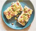  ??  ?? Ricotta toasts with melon and salami.