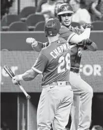  ?? Ray Carlin / Associated Press ?? Matt Olson, right, celebrates his sixth-inning homer in the A’s 4-1 win. Olson is set to participat­e in tonight’s Home Run Derby.