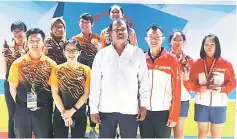  ??  ?? Winners of the Girls Doubles and their coaches pose with Tenpin Bowling India secretary Kannan Ramachandr­an after the prize presentati­on.