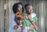  ??  ?? From left, Evan Alex, Lupita Nyong'o and Shahadi Wright Joseph are shown in a scene from “Us,” written, produced and directed by Jordan Peele.