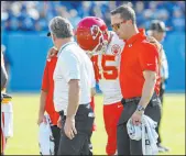  ?? ?? Chiefs quarterbac­k Patrick Mahomes leaves the field after being hit in the head during the fourth quarter.