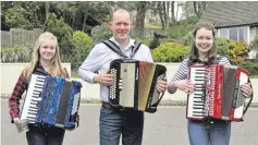  ?? 17_t18accordi­on01 ?? The McCormick family who competed in a number of events on Saturday. From left to right Isla, John and Kirsty.