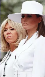  ??  ?? In white at the White House: Mrs Macron, left, and Melania Trump