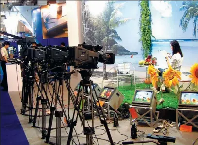  ?? JING WEI / FOR CHINA DAILY ?? An internatio­nal media industry exposition in Haikou, Hainan province. A survey shows that the output value of China’s media industry reached 637.9 billion yuan ($102 billion) in 2011, up 15.2 percent over the previous year.