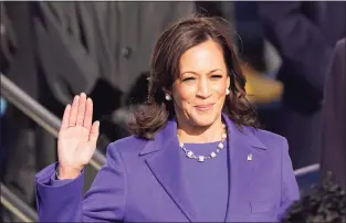  ?? Andrew Harnik / Associated Press ?? Kamala Harris is sworn in as vice president by Supreme Court Justice Sonia Sotomayor as her husband, Doug Emhoff, holds the Bible during the 59th Presidenti­al Inaugurati­on.