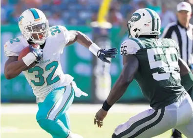  ?? AL BELLO/GETTY IMAGES ?? Kenyan Drake hasn’t been the featured back in an offense since high school. He played his entire career at Alabama as a backup.