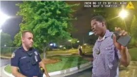  ?? ATLANTA POLICE DEPARTMENT VIA AP ?? In a screen grab taken from body camera video provided by the Atlanta Police Department, Rayshard Brooks, right, speaks with Officer Garrett Rolfe, left, in the parking lot of a Wendy's restaurant on June 12, 2020, in Atlanta.