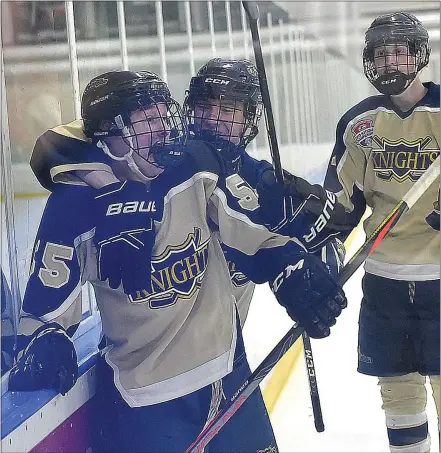  ?? PETE BANNAN — MEDIANEWS GROUP ?? West Chester Rustin’s Aiden Harris (56) embraces Alex Crook after Crook scored in Flyers Cup action against Unionville at Ice Line Wednesday night.