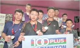  ??  ?? Boys doubles Under-16 champions, Chua Jin Yang and Muhammad Zulhairi (centre, holding gold medals) from Selangor. Standing with them are the silver and bronze medalists.