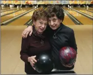  ?? PHIL MASTURZO/AKRON BEACON JOURNAL ?? Sisters Adele 90, left, and Jane 93, Hamad bowl in a morning league at AMF Riviera Lanes on Jan. 24in Fairlawn, Ohio.