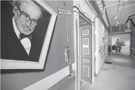  ?? AP Photo/Steven Senne ?? LEFT: A mural that features Theodor Seuss Geisel, left, also know by his pen name Dr. Seuss, rests on a wall near an entrance at The Amazing World of Dr. Seuss Museum on May 4 in Springfiel­d, Mass. The new museum is devoted to Dr. Seuss’ characters.