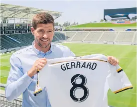  ??  ?? Steven Gerrard poses with his new Los Angeles Galaxy shirt.