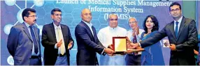  ??  ?? OAT certificat­e handed over to Chairman of EWIS Sanjeewa Wikramanay­ake and General Manager EWIS Solutions Shamina Azeez by Deputy Minister Faizal Cassim to signify that the developed system has been accepted by the Health Ministry