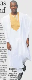  ?? Picture: AFP PHOTO ?? IN VOGUE: A man poses in a traditiona­l ‘agbada’