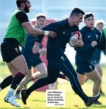  ?? HUW EVANS ?? Just Williams: Owen holds on to Scott at Wales training yesterday