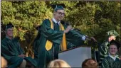  ??  ?? Valedictor­ian Ryan Ehresman speaks during the graduation on Monday.