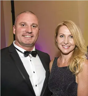  ?? PHOTOS: NEV MADSEN ?? John Chapman (Big Dog Security) and Natasha Lynch at the Heritage Bank Business Excellence Awards at the Empire Theatre.