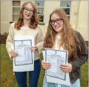  ?? Photo by John Delea ?? Twins Caitlin and Róisín Leonard were both delighted as they received their Leaving Cert results this morning at McEgan College, Macroom.