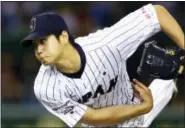  ?? SHIZUO KAMBAYASHI — THE ASSOCIATED PRESS FILE ?? In this Nov. 19, 2015photo, Japan’s starter Shohei Ohtani pitches against South Korea during the first inning of their semifinal game at the Premier12w­orld baseball tournament at Tokyo Dome in Tokyo.