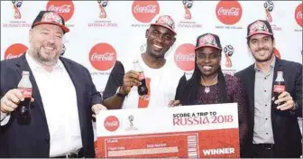  ??  ?? L-R, Managing Director, Nigerian Bottling Company Limited, Mr. George Polymenako­s; Winner of the Coca-Cola ‘Score A Trip To Russia 2018 Promo’, Benjamin Muo; Legal, Public Affairs and Communicat­ion Director, Nigerian Bottling Company Limited, Mrs. Sade...