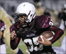  ?? SERGIO BASTIDAS PHOTO ?? Calexico High School’s Chris Gonzalez runs the ball against Vincent Memorial High School during a non-league football game on Friday night in Calexico.