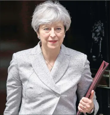  ?? PHOTO: BLOOMBERG ?? Theresa May, UK prime minister, leaving number 10 Downing Street in London. May’s hardline Brexit rhetoric has been repudiated by her Chancellor of the Exchequer Philip Hammond.