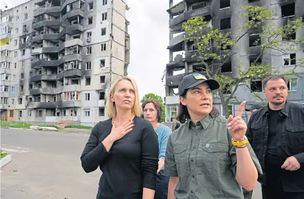  ?? ?? VISIT: US ambassador to Ukraine Bridget Brink, left, and Ukraine’s prosecutor general Iryna Venediktov­a viewing damage in Borodyanka, near Kyiv.