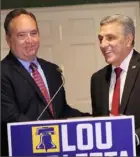  ?? Michael M. Santiago/Getty Images ?? Jake Corman, Senate pro tempore and former GOP candidate for Pennsylvan­ia governor, shakes hands with Lou Barletta, whom he endorsed in the race.