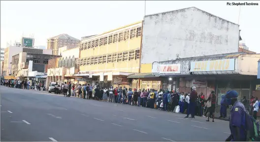  ?? Pic: Shepherd Tozvireva ?? Stranded commuters wait for transport along Chinhoyi Street in Harare yesterday. Transport challenges have continued since government eased lockdown regulation­s, but banned private commuter omnibuses, with the public transporte­r Zupco failing to cope with the huge volumes.