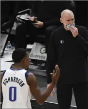  ?? PAUL BEATY — THE ASSOCIATED PRESS ?? Dallas Mavericks head coach Rick Carlisle and Josh Richardson argue with referees after Richardson was called for a foul during the second half of Jan. 3 game against the Chicago Bulls. Both Dallas and Chicago saw their most recent games on the schedule canceled due to virus-related concerns. Dallas was supposed to play against the New Orleans Pelicans Monday; Chicago was set to face the Boston Celtics today before the cancellati­on.